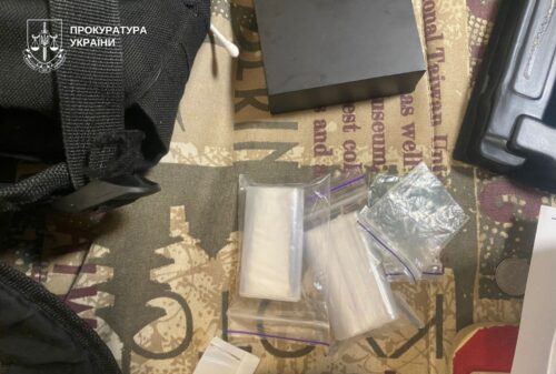 Small resealable bags with white powdery substances on a patterned surface; Ukrainian Prosecutor's Office watermark in the corner.