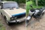Two-vehicle crash scene: left panel shows a dented beige car with a blue trim; right panel shows a silver motorcycle on a grassy path with police branding in the corner.
