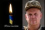 Left: lit candle with blue-yellow ribbon and Ukrainian phrase 'Eternal memory' in Ukrainian; right: a soldier in camouflage cap facing the camera.