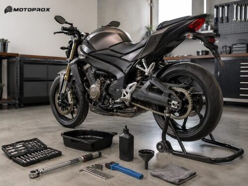 Black sport motorcycle on a rear stand in a workshop, surrounded by tools, oil bottle, and a toolbox on the floor.