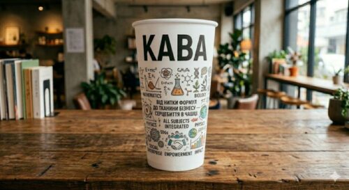 Disposable cup with 'KABA' logo and doodle illustrations on a wooden table in a bright cafe, a promotional beverage cup.