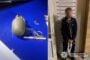 Left: a discarded hand grenade or explosive device with pin and wiring on a blue surface; right: a blurred man in a dark tracksuit standing by a height-measuring wall during a police mugshot (Ukrainian police emblem)