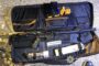 Open rifle case displaying a long gun with magazines, ammunition, and cleaning supplies arranged inside