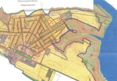 Cadastral map showing parcel boundaries, streets, and surrounding water on the right, labeled in Cyrillic.